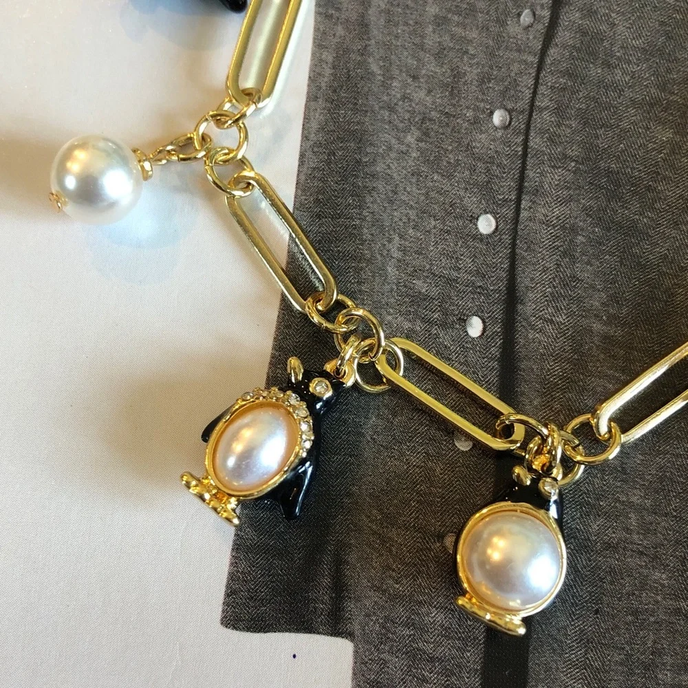 Authentic kate spade NWT Gold Charm Bracelet with Pearls and Black Penguins